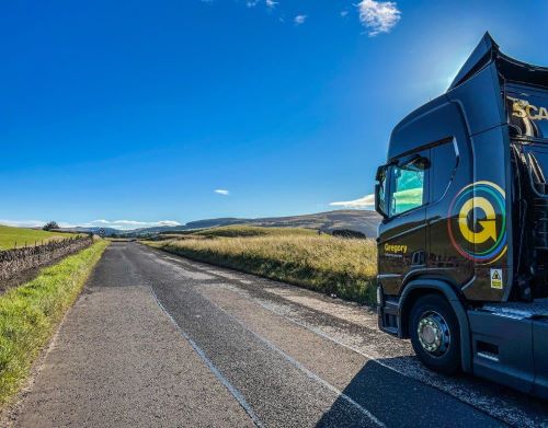 Gregory truck on edge of road.