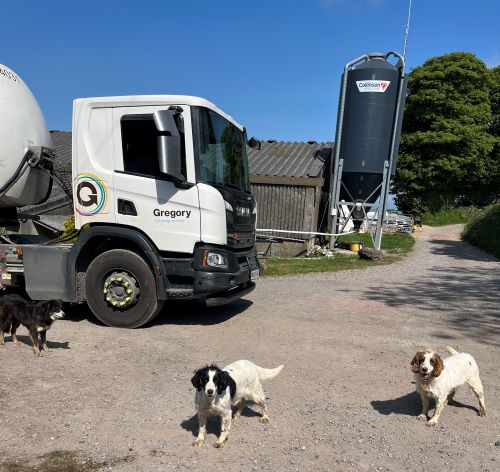 Milk tanker on farm.