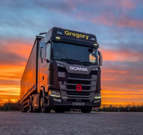 Gregory lorry in front of sunset.