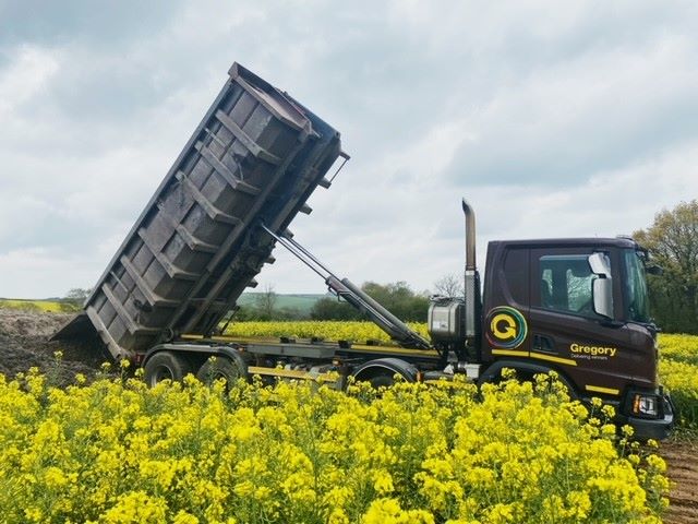 Gregory tipper in field of rapeseed.