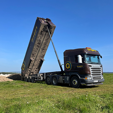 Gregory vehicle tipping in field.