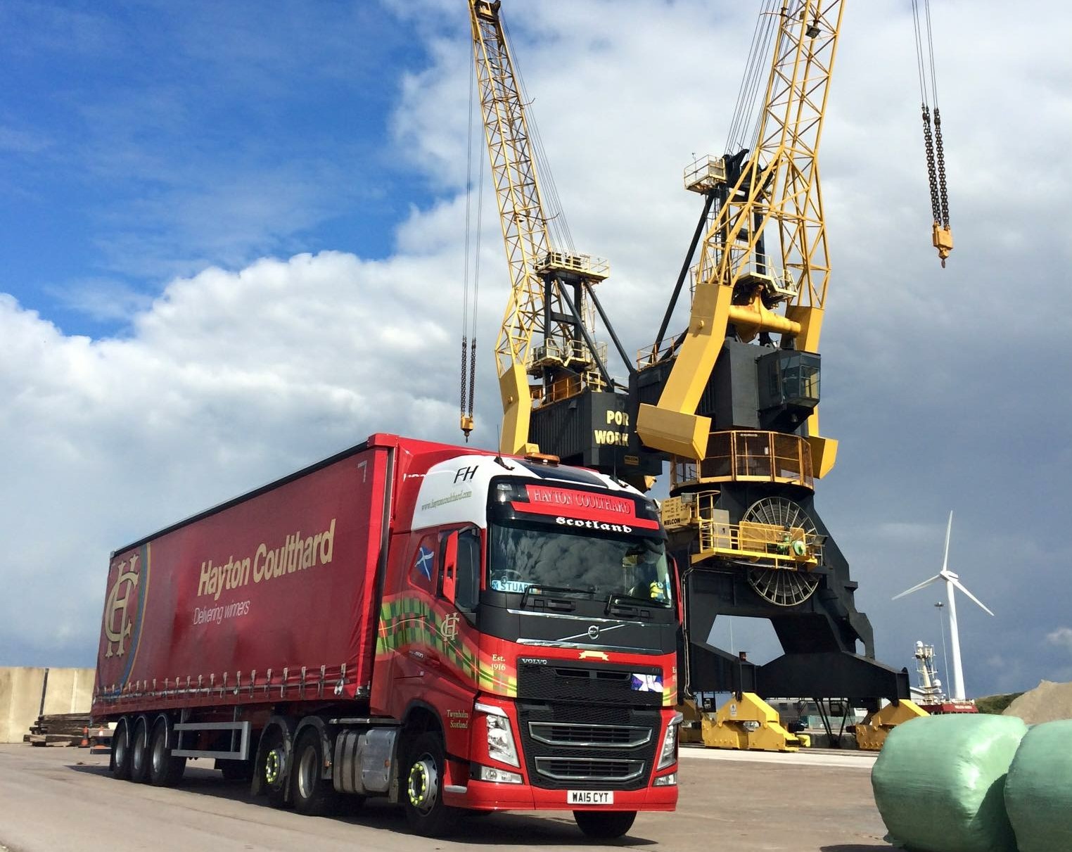 Hayton Coulthard lorry by port crane.