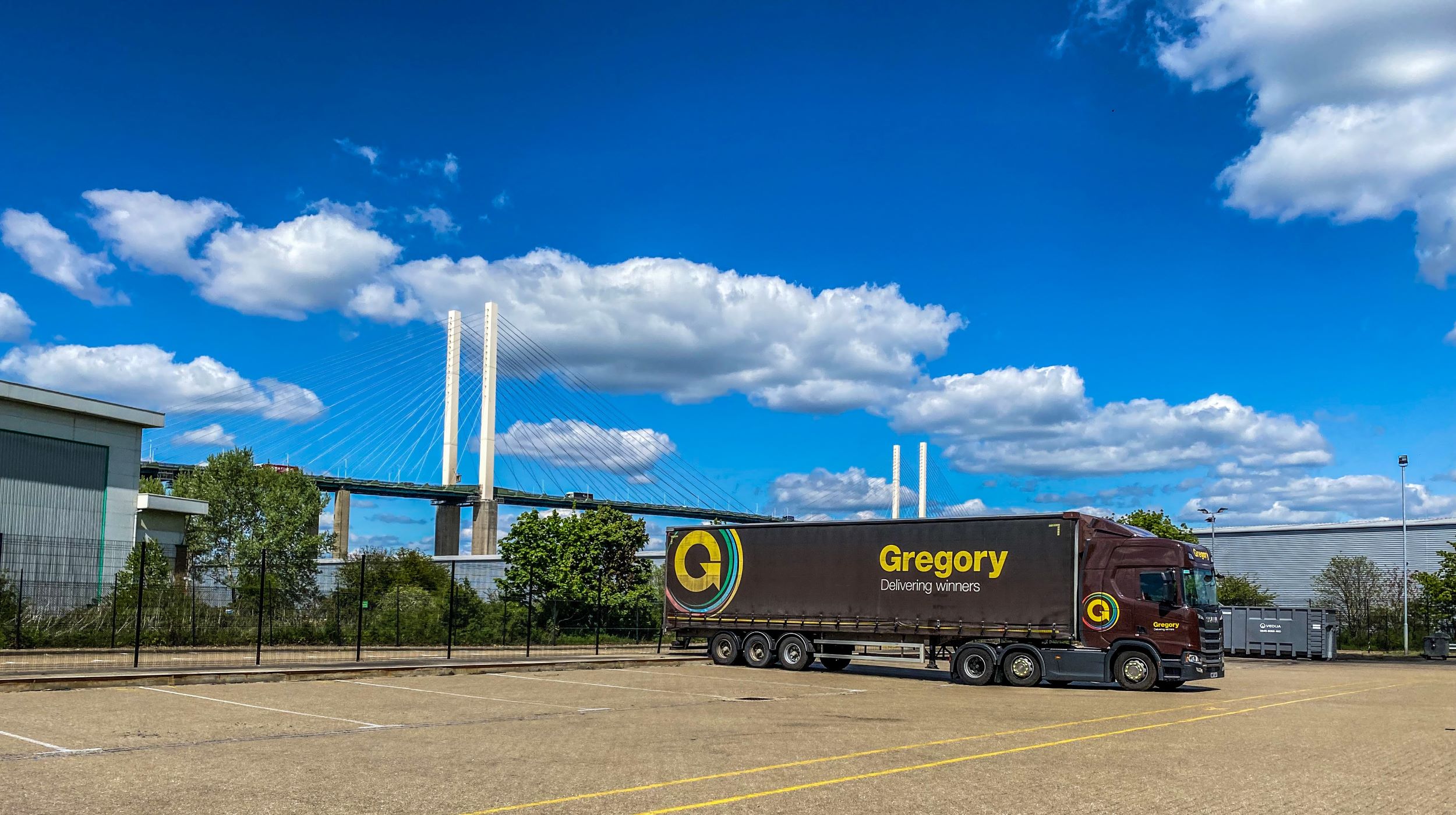 Gregory lorry with bridge in background.