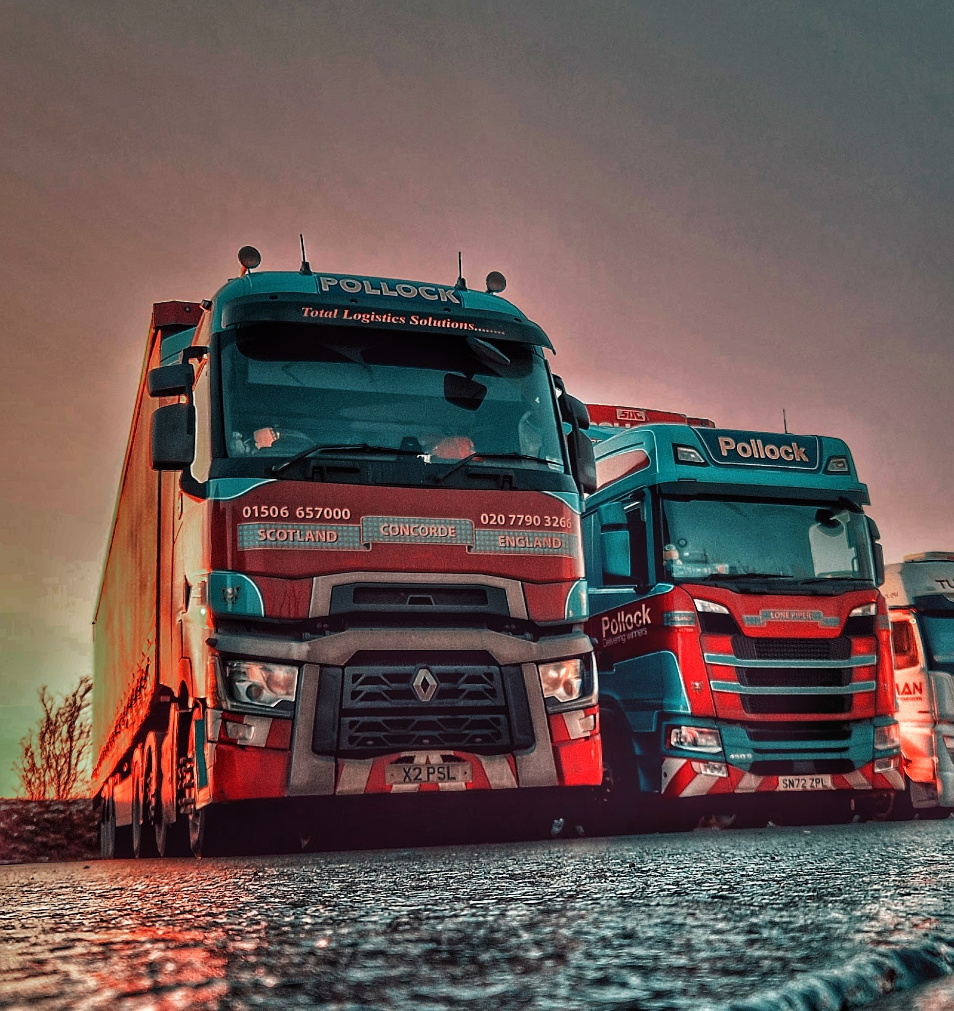 Two Pollock trucks next to each other.