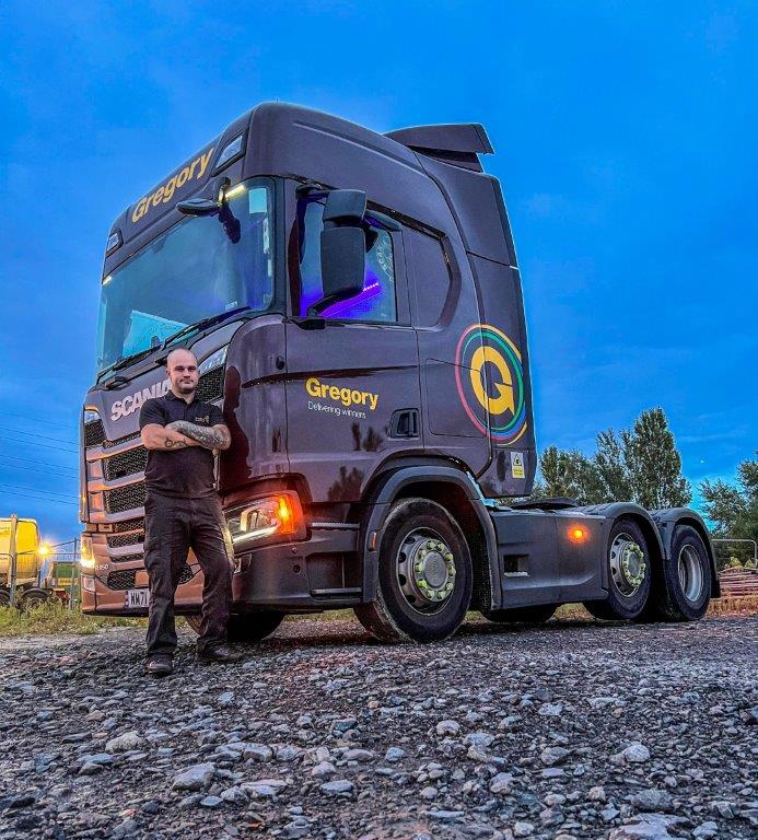 Jason Leake next to truck.
