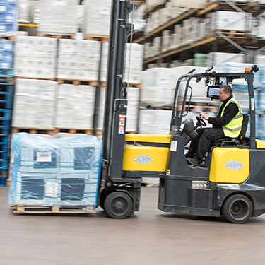 Forklift in warehouse.